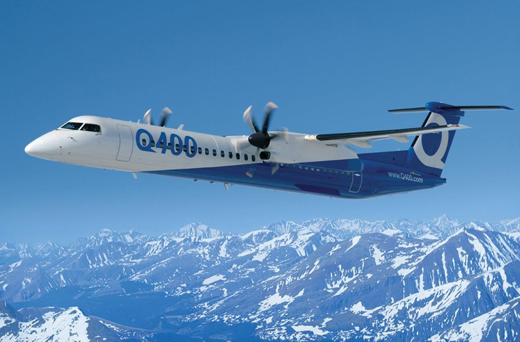 Turboprop aircraft over mountains